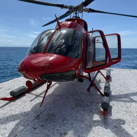 The helicopter waiting on the reef pontoon