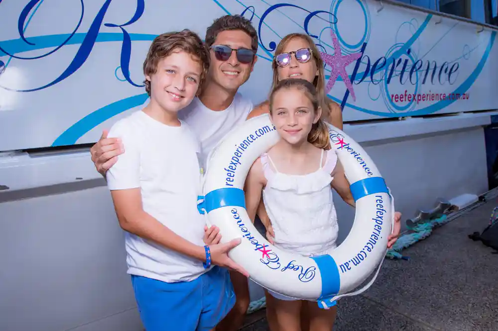 A family holding the operator's life ring on deck