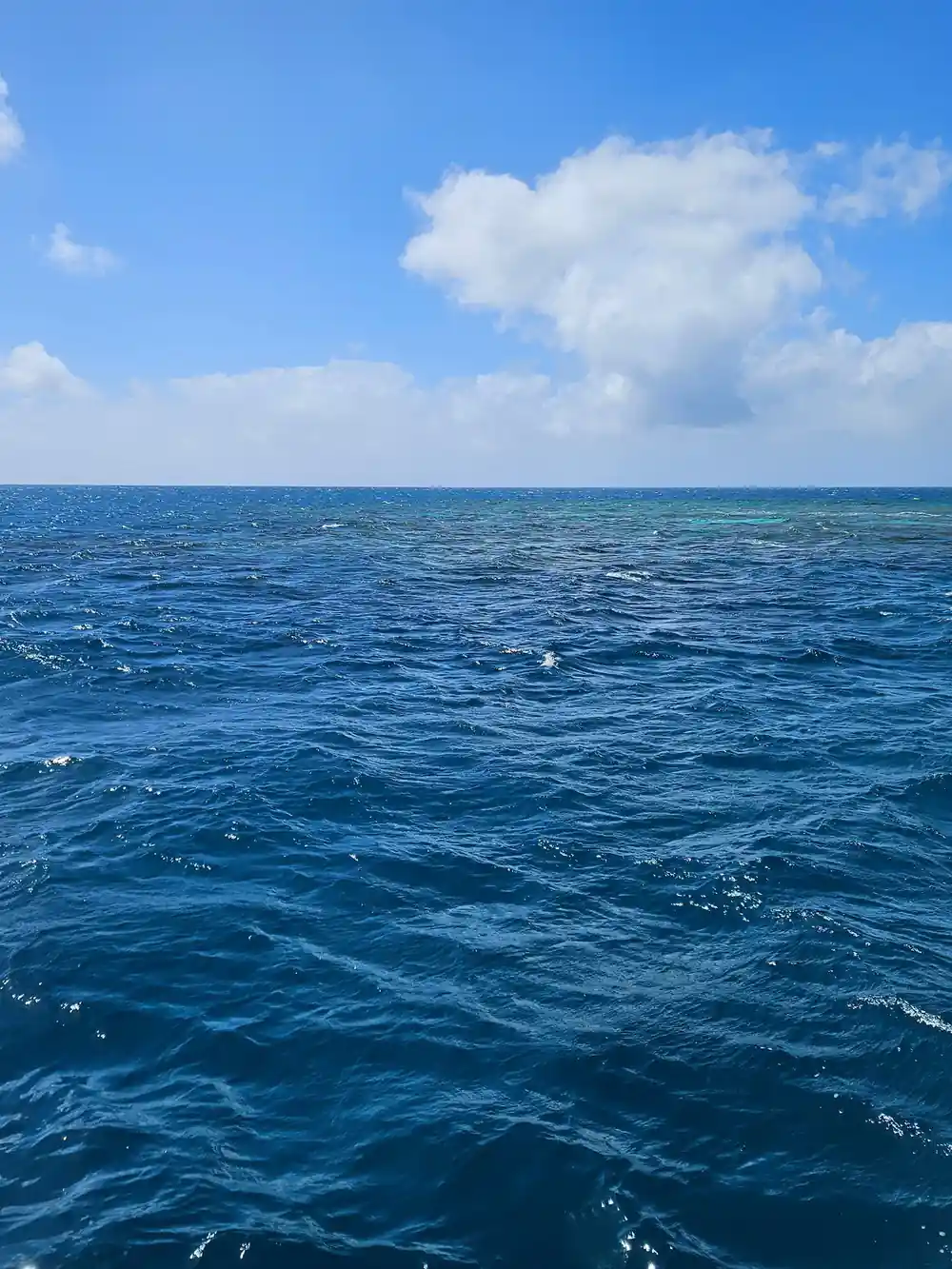 Open reef water and cloud from the deck